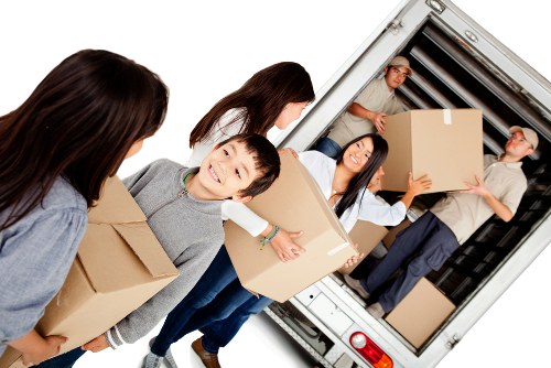 Man with van in Croydon loading boxes for a transparent-priced move