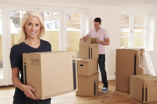 Loading household furniture into a van for transport in Croydon