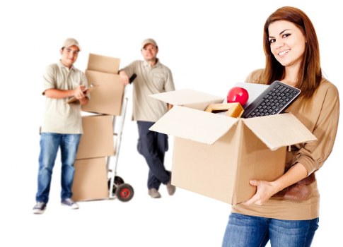Local removals team handling furniture in a Croydon property