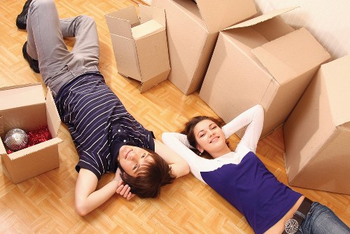 Packed office boxes and desks ready for relocation