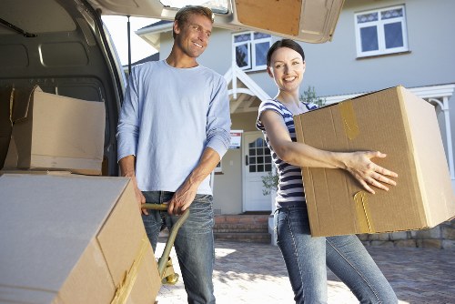 Removal team preparing household items for transport in Croydon
