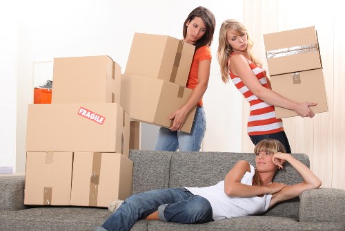 A local moving team preparing boxes in a Croydon apartment building